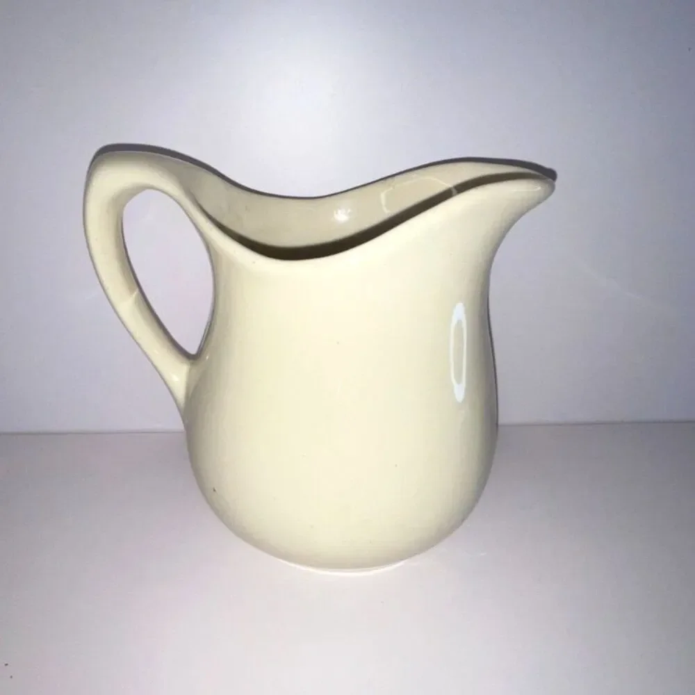 Beautiful vintage white stoneware pitcher; measures 6